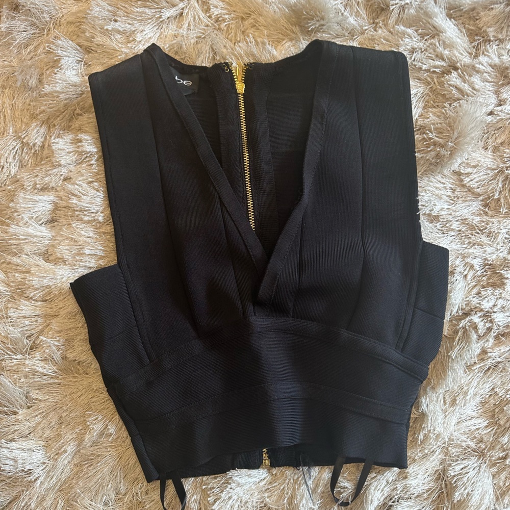 Bebe women's black crop top. With gold zipper back size xs